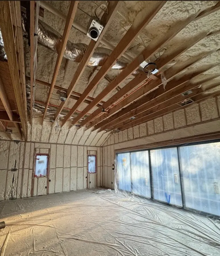 Interior walls and ceiling insulated with spray foam during new construction in Plain City